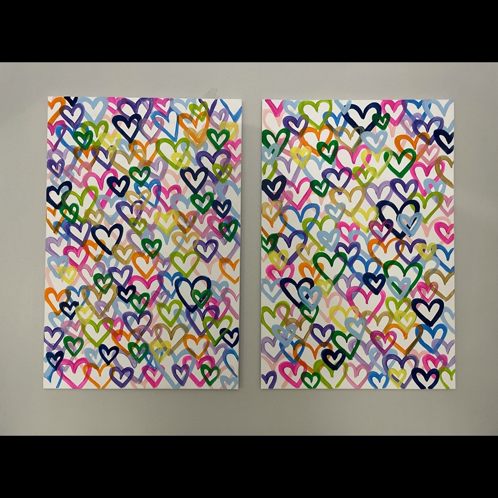 two hand painted heart canvases